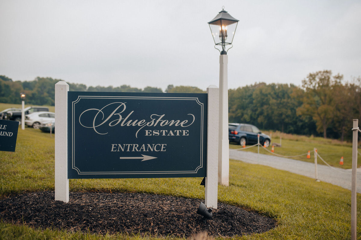 large sign pointing to the entrance of an estate