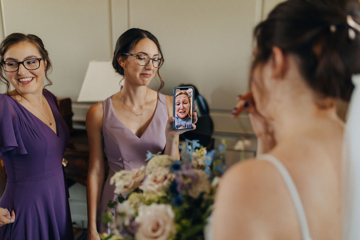 Celebrant facetiming a friend for a first look.