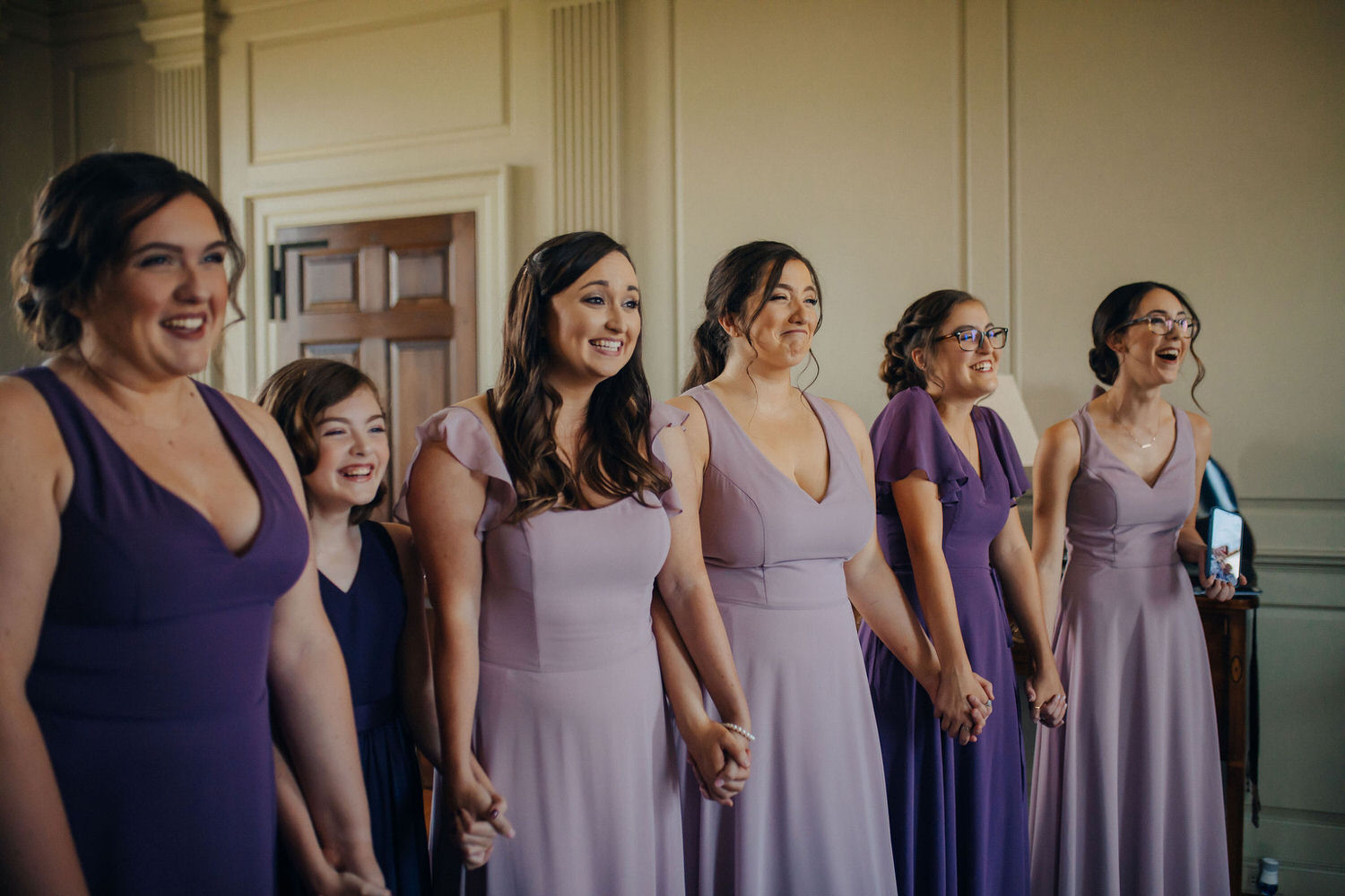 Set of people in purple dresses.