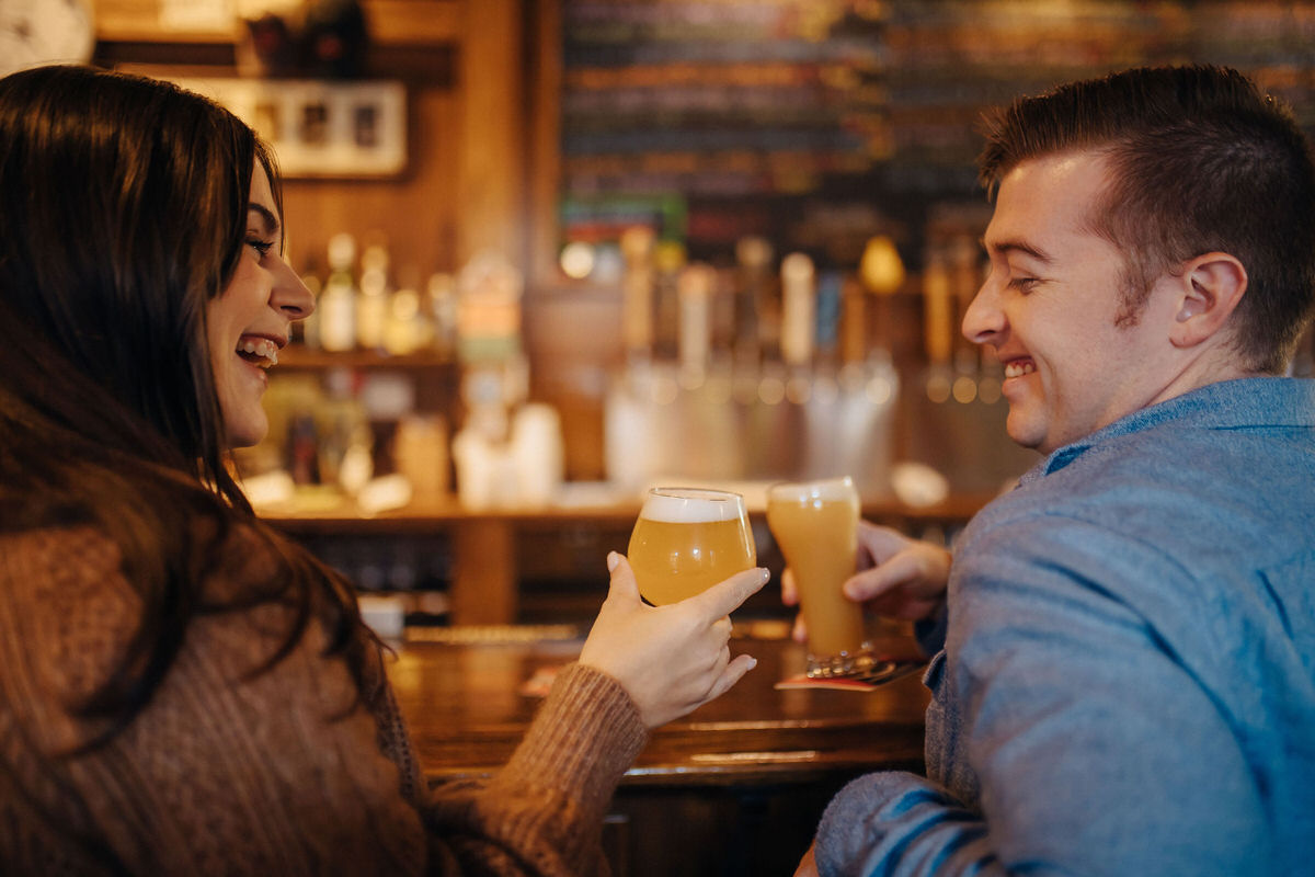 couple drinking beer at a brewery