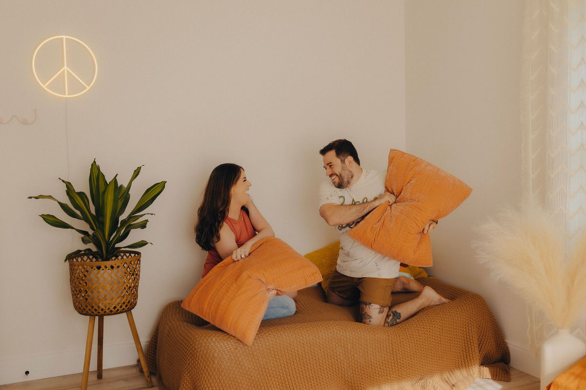 couple during a pillow fight 