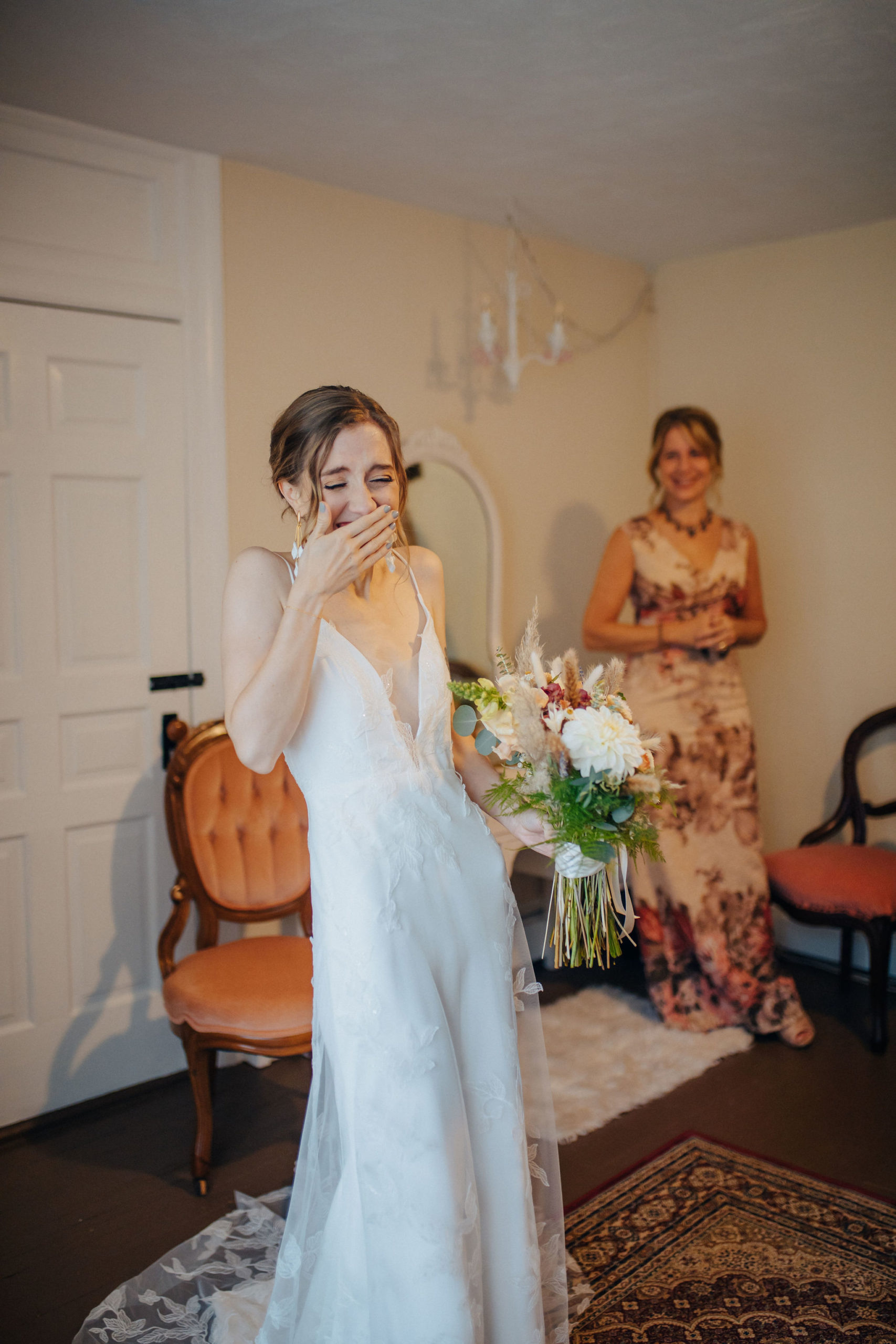person smiling in a room with their wedding party
