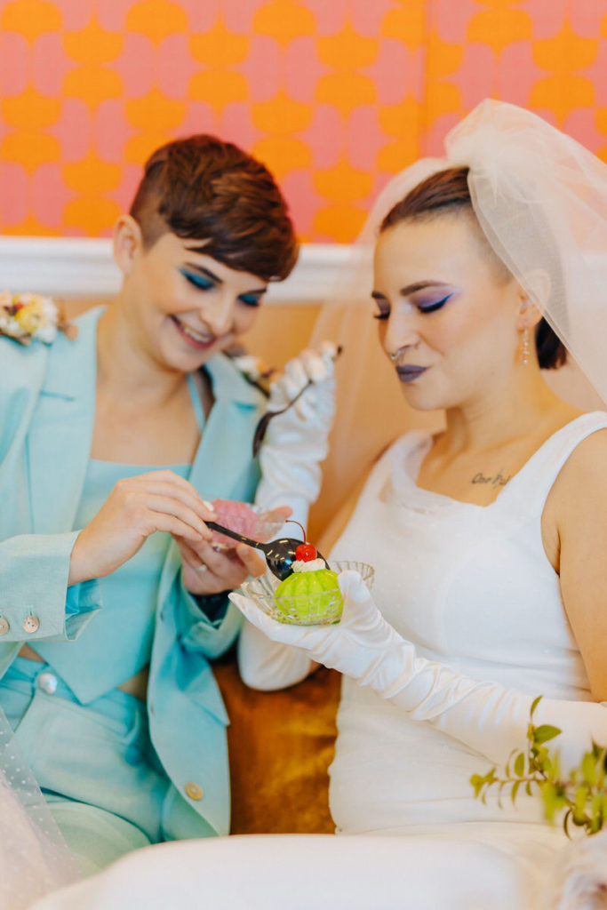 wedding couple sharing a dessert togther