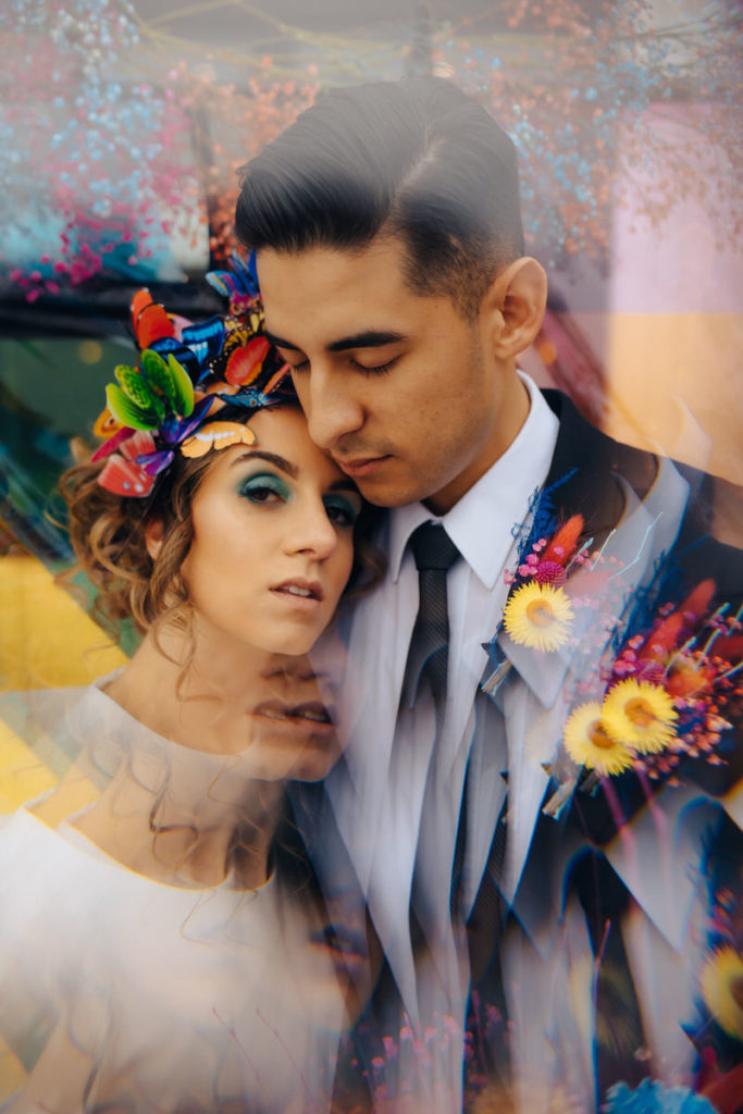 picture of a wedding couple standing next to each other with a prism effect around them
