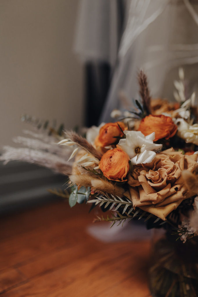 orange, white, and tan bouquet of flowers 