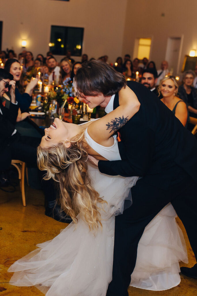 A wedding couple dancing during their first dance. 
