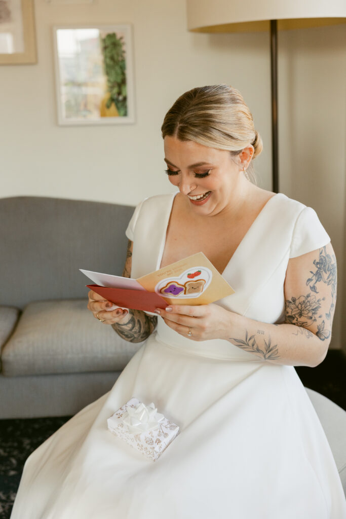 A bride reading a hand-written card in private as a personal touch on her wedding day