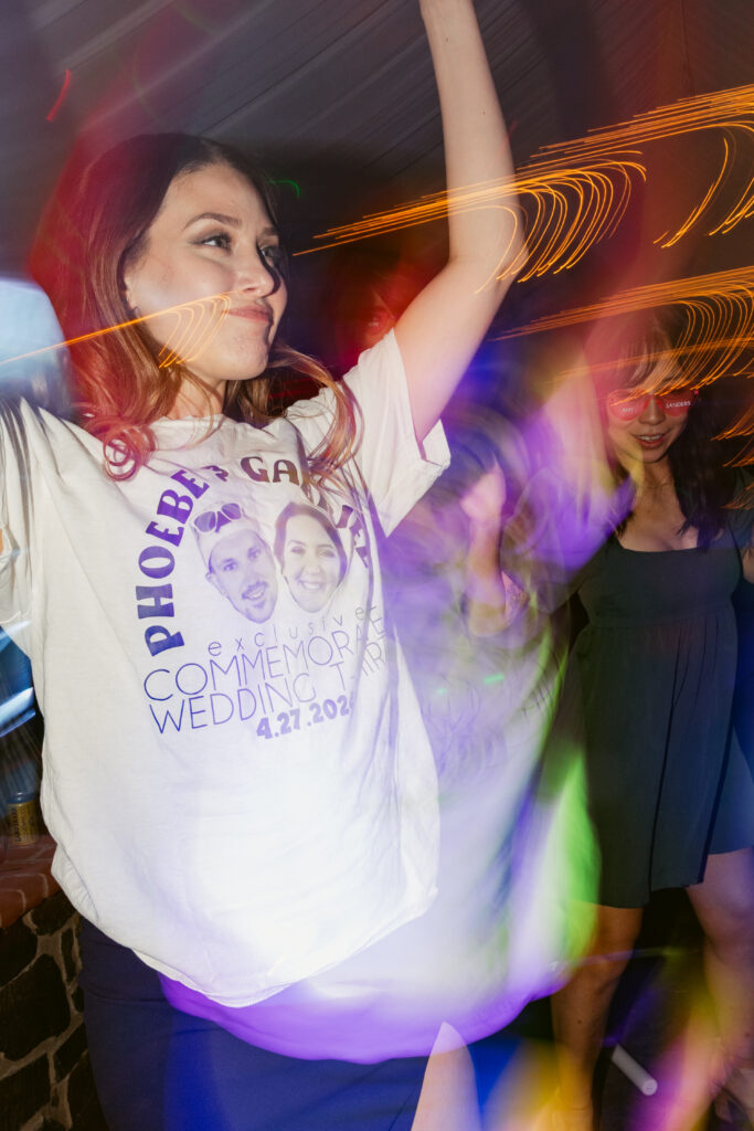 A guest dancing in a customized t-shirt she caught